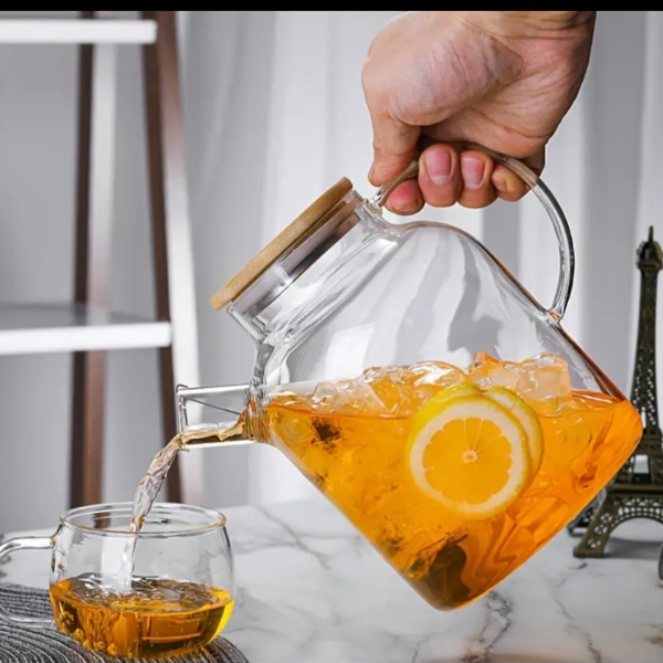 Large capacity clear glass teapot with removable filter spout, heat resistant.